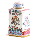 A continental porcelain tea caddy and lid, decorated in Chinese armorial style, pseudo mark to under