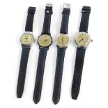 A set of four Russian collectors watches, each with various designs and champagne coloured dials.