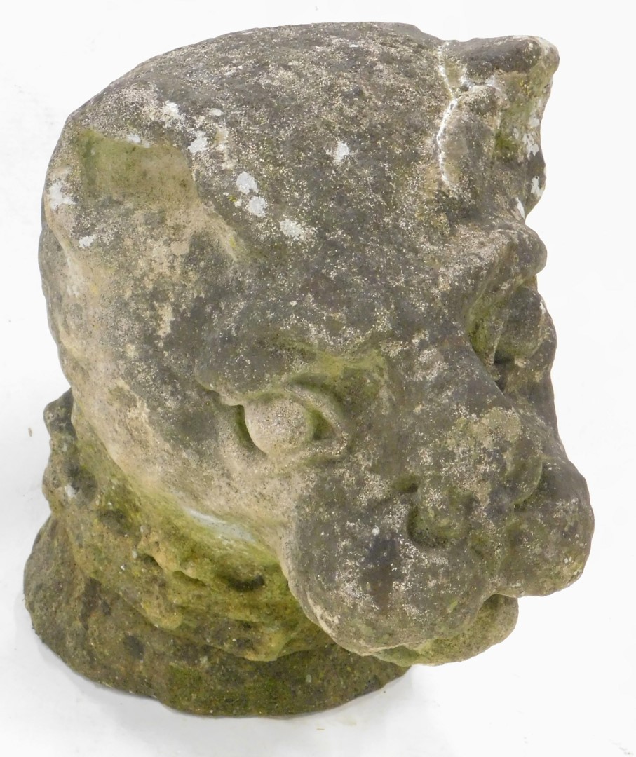 A large Heraldic stone carving of a lion, wearing an indistinct crown to its neck, (AF), 43cm high,