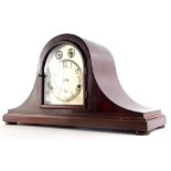An early 20thC mahogany mantel clock, with Westminster chime in Napoleons hat shaped case, the movem