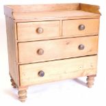 A Victorian pine wash stand, with a raised back above two short and two long drawers on turned feet.