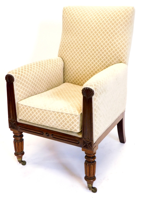 A William IV mahogany armchair, upholstered in patterned fabric, the channelled arm supports headed