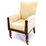 A William IV mahogany armchair, upholstered in patterned fabric, the channelled arm supports headed