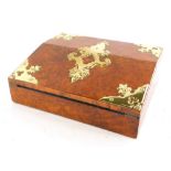 A Victorian figured walnut and brass writing slope, the hinged lid enclosing a velvet lined interior