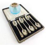 A set of six George VI silver teaspoons, in a fitted case, Birmingham 1939, 2¼oz, and a blue glass m