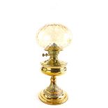 A Victorian brass oil lamp, with leaf cast column and stepped domed foot, later associated shade, 54