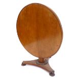 A Victorian mahogany breakfast table, the circular top with a moulded edge, on an octagonal tapering