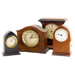 A collection of four mantel timepieces, to include a late 19thC French example in amboyna veneered c