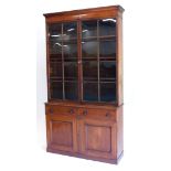 A mahogany glazed bookcase, the top with a reeded and moulded cornice above two astragal glazed door