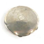An Edward VIII silver powder compact, with engine turned decoration and vacant cartouche, the interi