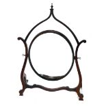 A mahogany dressing table mirror, in Chinese Chippendale style with a shaped frame, oval plate, 78cm