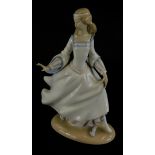 A Lladro porcelain figure of lady wearing a flowing dress, impressed no. 4828 to underside, 25cm hig