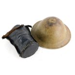 A World War Two Brodie helmet, collected by the vendor in Normandy France, and a gas mask. (2)