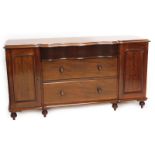 A Victorian mahogany sideboard, the top with a moulded edge above an arrangement of three drawers, f