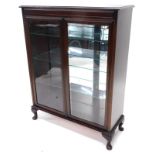 A Waring and Gillow mahogany display cabinet, the top with a moulded cornice above two glazed doors,