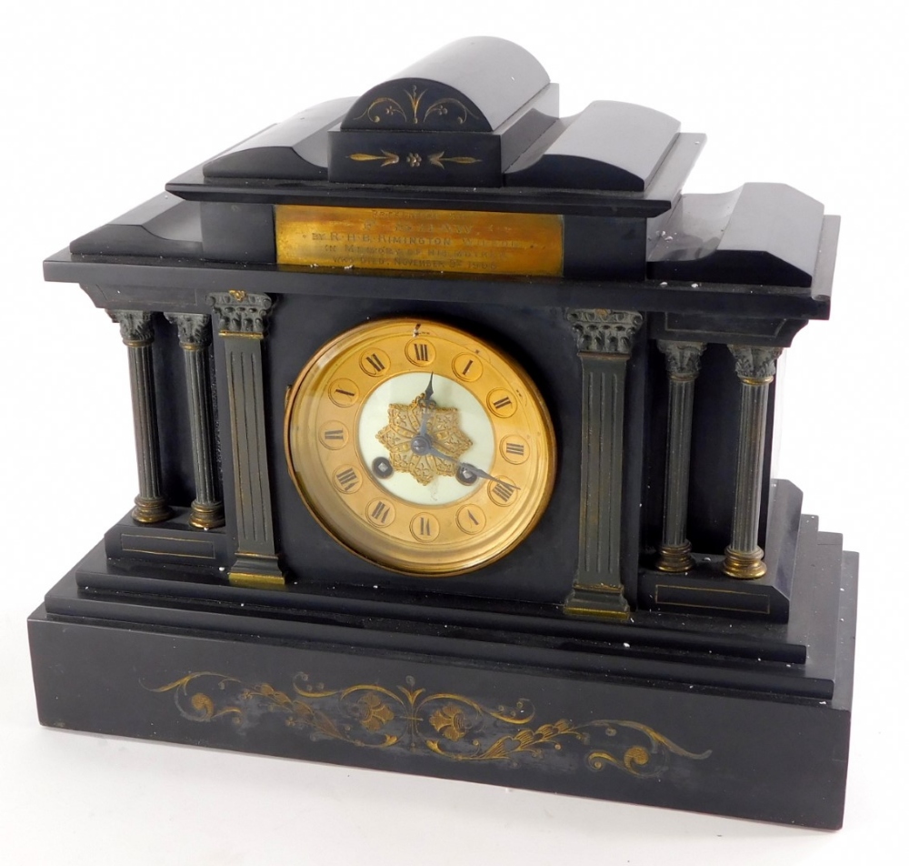 A late 19thC/early 20thC French black slate portico shaped mantel clock, with reeded Corinthian colu