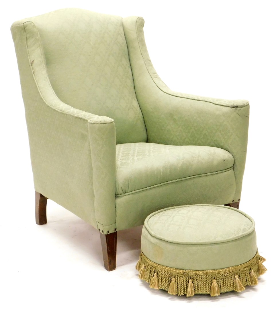 An Edwardian mahogany armchair, upholstered in green damask fabric, on square tapering legs with ass