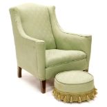 An Edwardian mahogany armchair, upholstered in green damask fabric, on square tapering legs with ass