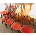 A set of ten oak slat back pub type chairs, with red velvet seats.