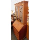 A mahogany bureau bookcase, the top with astragal glazed doors, the fall above four drawers.