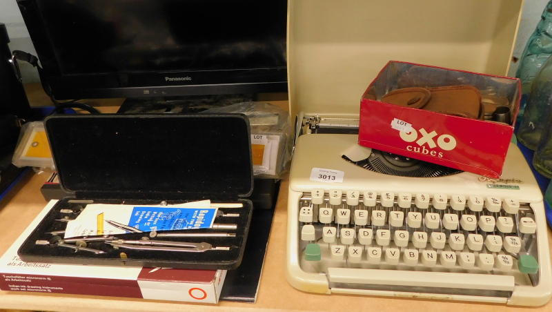 An Olympia Splendid 33 cased typewriter, various rules, drawing instruments, Indian ink drawing inst