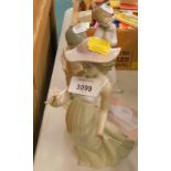 Three Nao figures, to include a lady holding a flower, 26cm high, young girl with puppy, 20cm high,