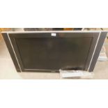 A Philips 32 inch flat screen television, with lead and remote.