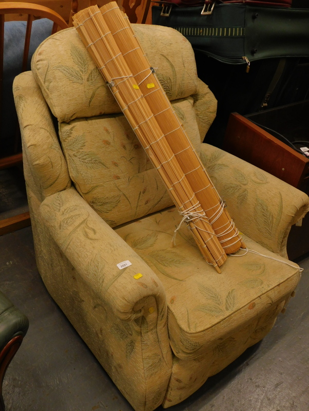 A G-plan armchair, decorated in floral fabric, and two blinds.