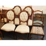 A set of four Italian style dining chairs, with over stuffed back and seats, on cabriole legs, and t