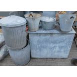 A quantity of galvanised metal wares, to include a lidded dust bin, various buckets, a container wit