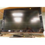 A 32" LG flat screen television, with lead and remote.
