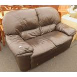 A modern brown leather two seater sofa.