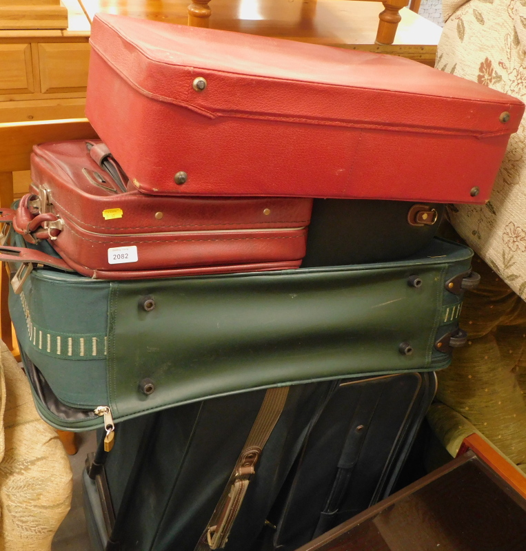 A quantity of suitcases and holdalls, to include Antler, Revelation, etc. (a quantity)