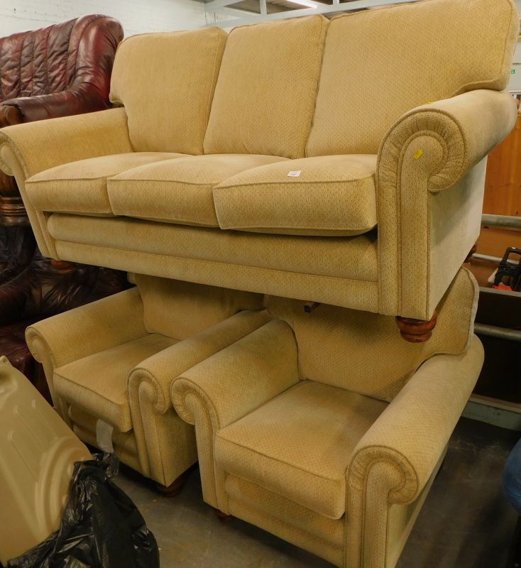 An Alstons Upholstery three seater sofa, and two matching armchairs.