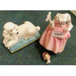 A Beswick figure of a seated Poodle on a cushion, and a Royal Doulton figure of a lady, Ballad Selle