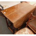 An oak gate leg table, 75cm high.