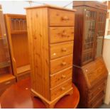 A collection of furniture, to include a yew extending dining table, a pine chest of six drawers, and