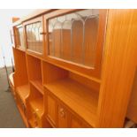 A teak G-Plan free standing corner cabinet, a teak G-Plan display unit, with two glass doors to the