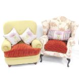 A floral upholstered wing back broad seated armchair on cabriole legs, and another button back examp