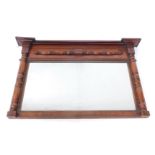 A Victorian mahogany overmantel mirror, with turned columns, enclosing a reeded slip rectangular pla