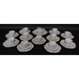 A Wileman Foley porcelain tea service, printed with a design of flowers, in blue and brown, pattern