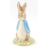 A Beswick Beatrix Potter figure modeled as Sweet Peter Rabbit, limited gold edition 1662/2950, boxed