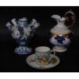 A Kerr & Binns Worcester porcelain coffee cup and saucer, Delft tulipiere and a Heubach Gebruder lat