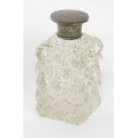 A late 19thC/early 20thC cut glass scent bottle, with a silver lid, and inner stopper, marks indisti