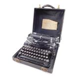 A vintage Remington "World Service" noiseless portable typewriter, with continental AZERTY keyboard,