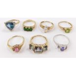 A collection of seven 9ct gold dress rings, mounted with different semi precious stones.