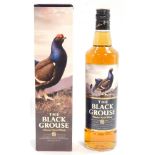 A bottle of The Black Grouse Blended Scotch Whisky, boxed.
