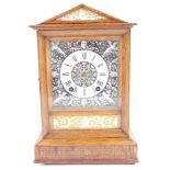 A Winterhalder and Hofmeier late 19thC oak cased mantel clock, the enamel square dial decorated in t
