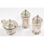 A George VI/Elizabeth II silver three piece condiment set, with a matched silver mustard spoon and b