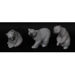 Three Lladro porcelain figures modelled as Polar bears, in various poses, 10cm high.